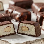 Sugar-free Almond Joy bars with coconut filling, almonds, and dark chocolate coating