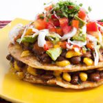 Crunchy Vegan Tostadas with Flavorful Refried Beans Delight